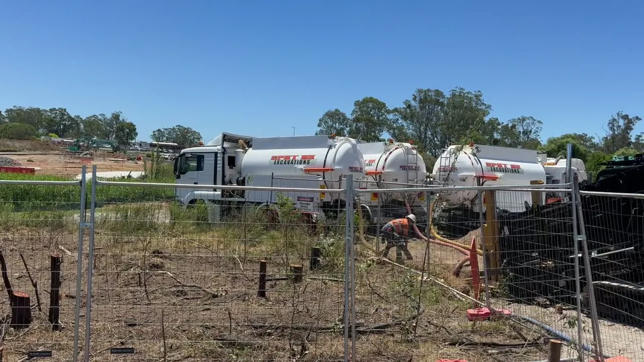 Spot On vacuum excavation trucks and a directional drilling rig on a worksite.